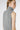 Left side view of sleeveless Costi cashmere pullover with turtleneck