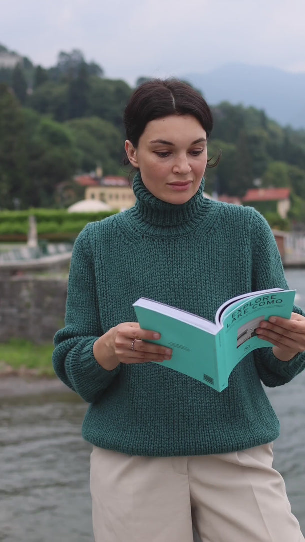 Model wearing the Dino Cashmere Pullover in Deep Teal by Incentive Cashmere, filmed by Lake Como to capture its elegant movement and timeless allure.